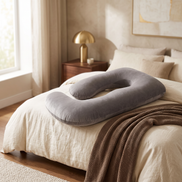 U-Shaped Pregnancy Pillow on a made bed
