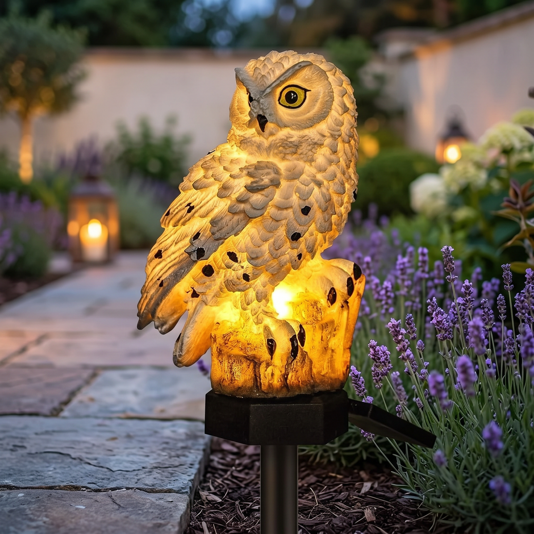 Solar Owl Garden Light in a garden at dusk