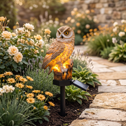 Solar Owl Garden Light in a flower bed