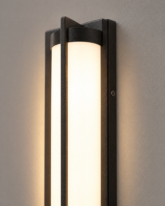 Close-up of the Nerolo sand-black frame and glowing white diffuser