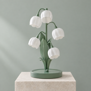 Muguet lily of the valley table lamp with five frosted white bell shades and sage green leaves