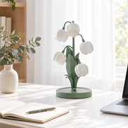 Muguet table lamp on a white desk in a bright home office