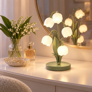 Muguet lily of the valley lamp on a vanity table with a mirror
